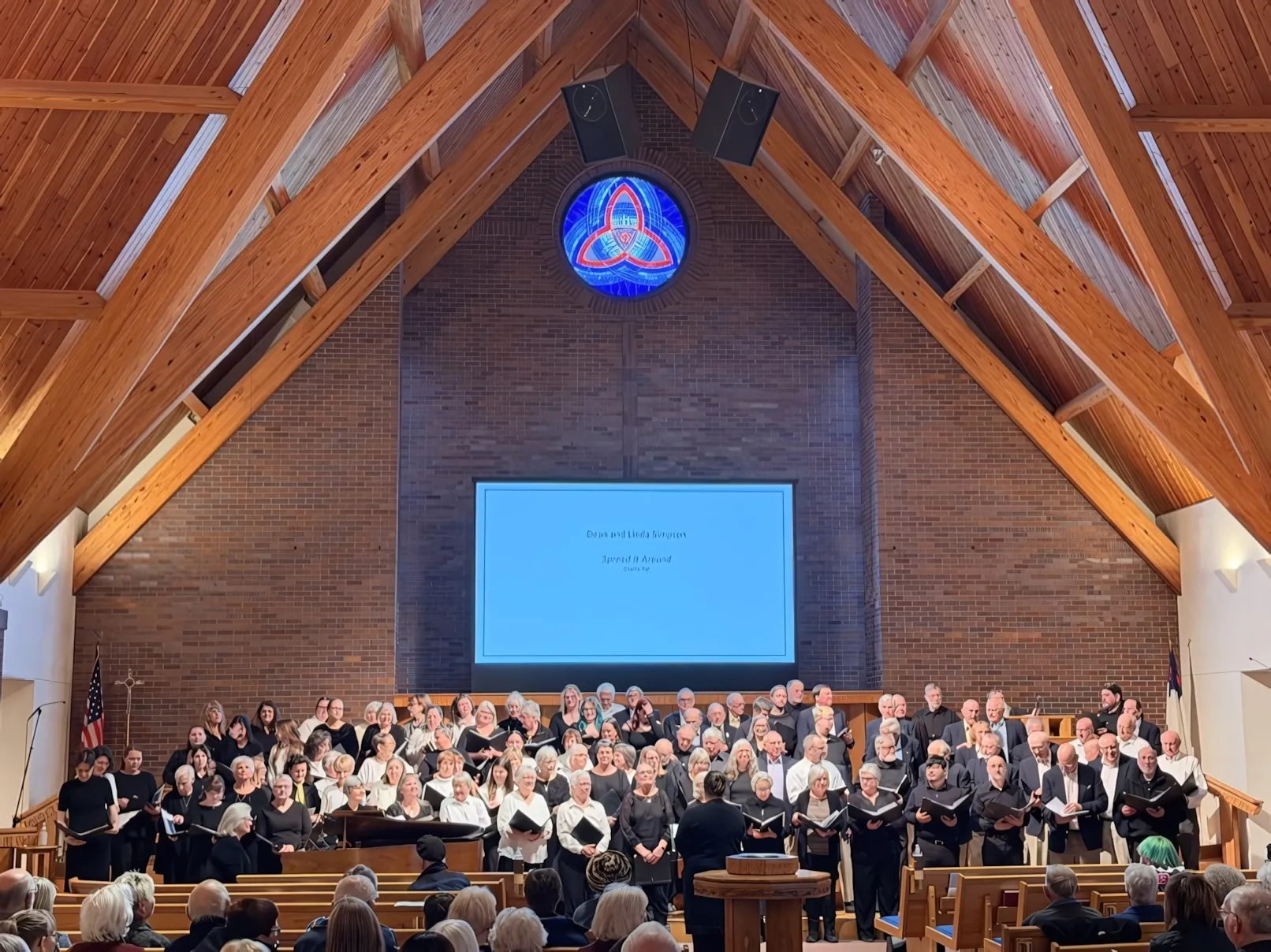 A mass choir performing at the It Takes a Village benefit concert.
