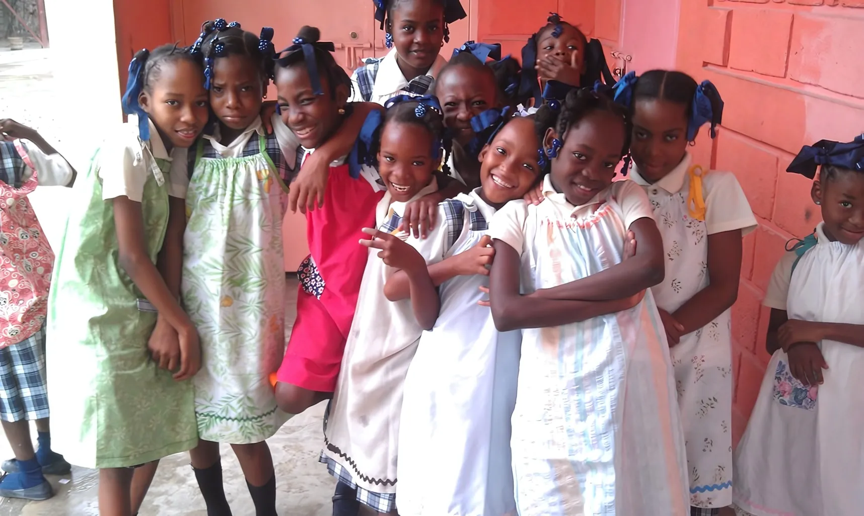 Girls at a Haitian school wearing handmade pillowcase dresses.